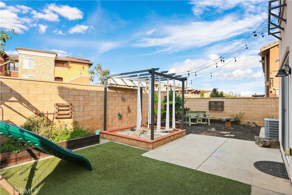 13170 Winslow Drive Rancho Cucamonga, CA 91739 - Photo 45 of 57 a view of a patio with a table and chairs