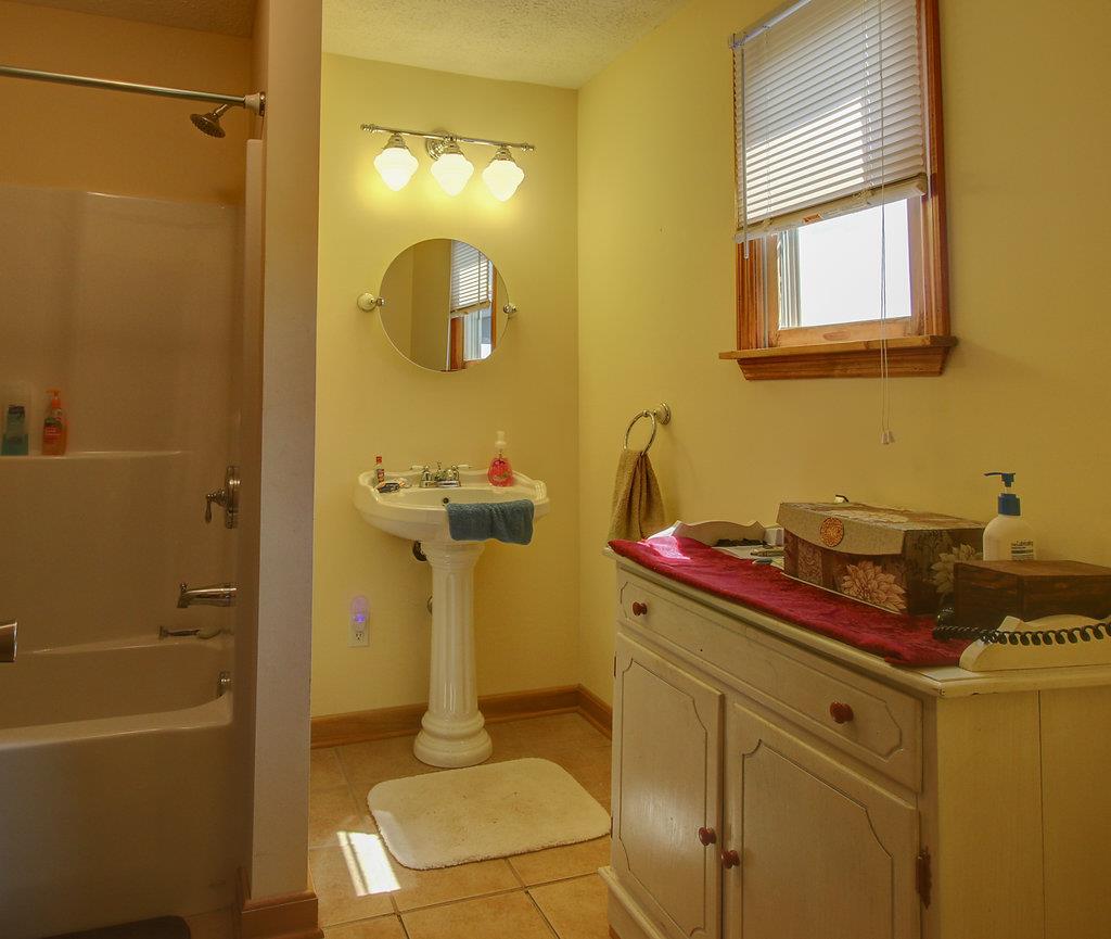 3920 Corbin Sneed Road Springfield, TN 37172 - Photo 14 of 29 a bathroom with a sink and a mirror