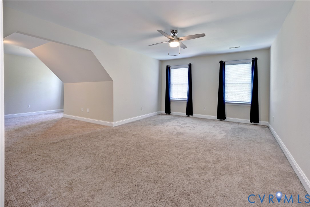 11385 Winding River Road Providence Forge, VA 23140 - Photo 26 of 43 a view of an empty room with chandelier fan