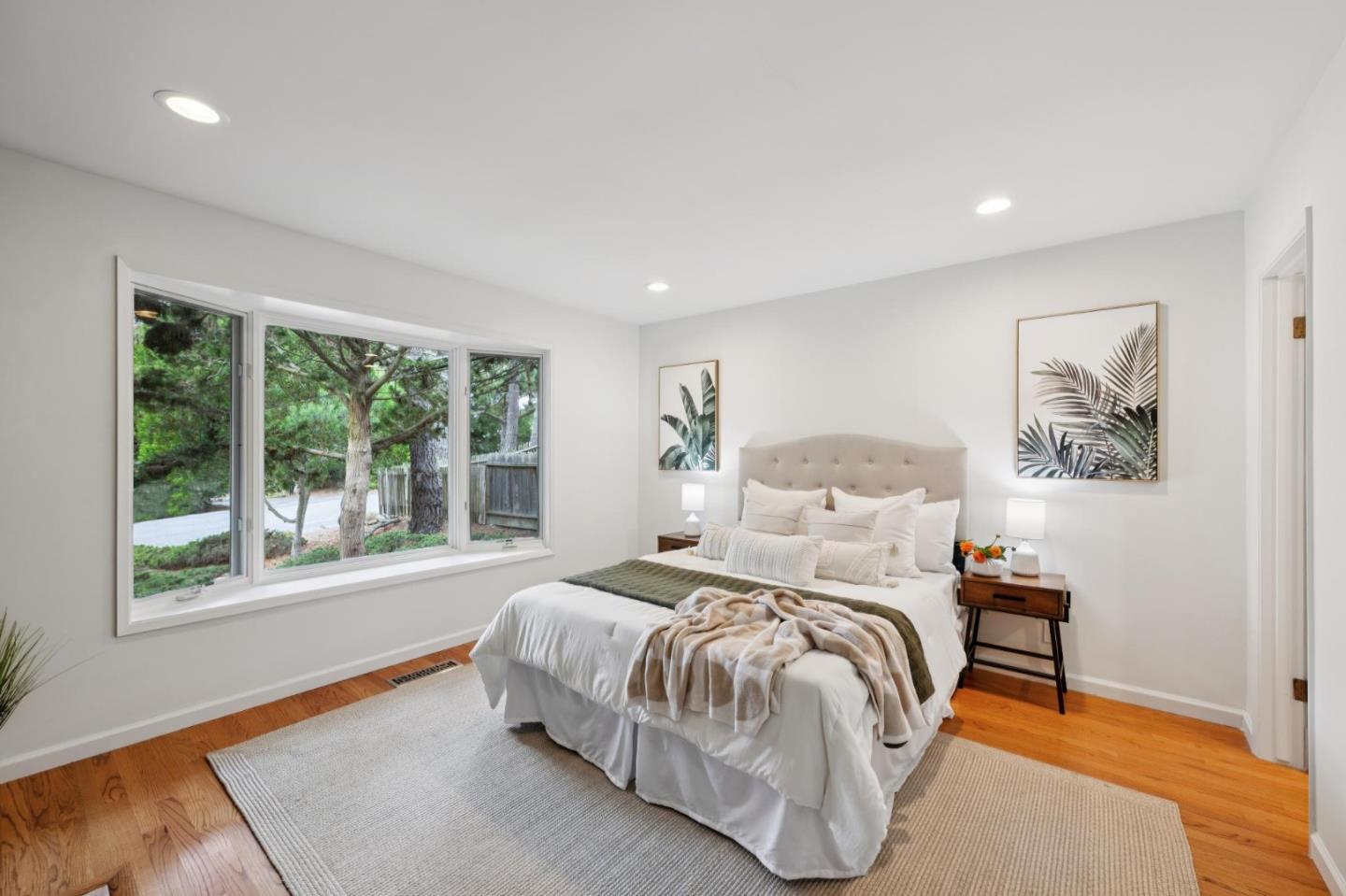 4083 Sunset Lane Pebble Beach, CA 93953 - Photo 44 of 54 a bedroom with a bed and a large window