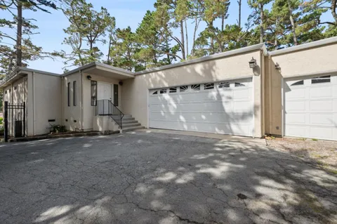 a view of a house with a street