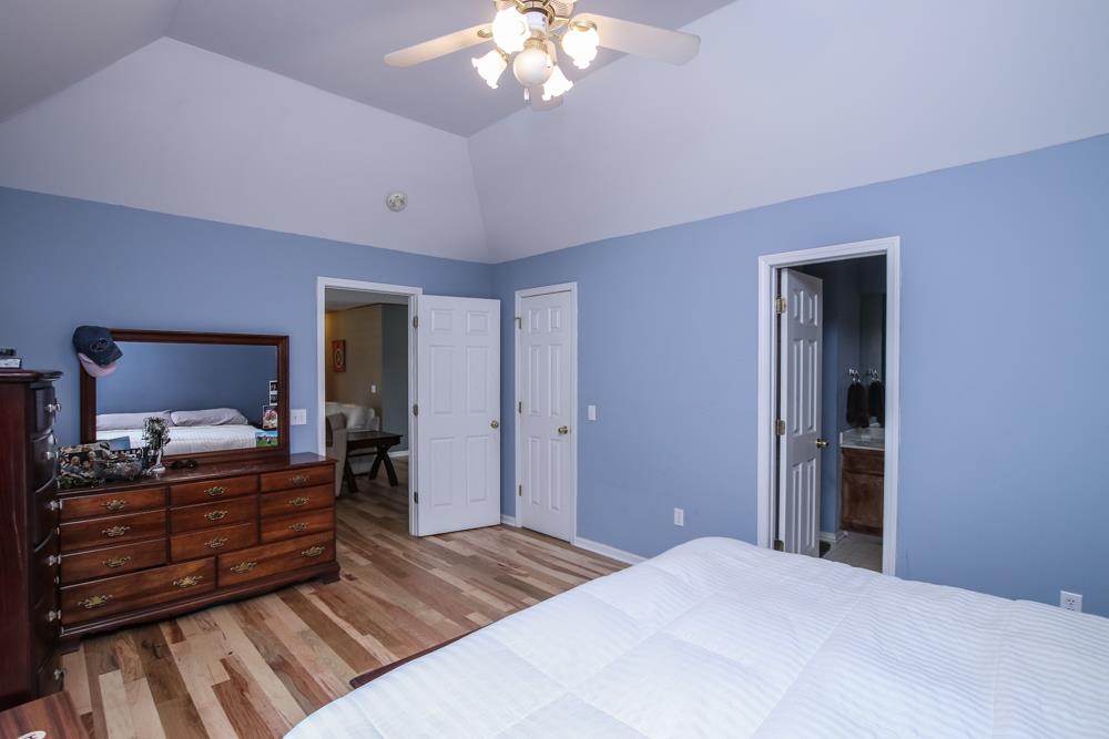 611 Audrey Road Mount Juliet, TN 37122 - Photo 14 of 24 a bedroom with a bed and wooden floor