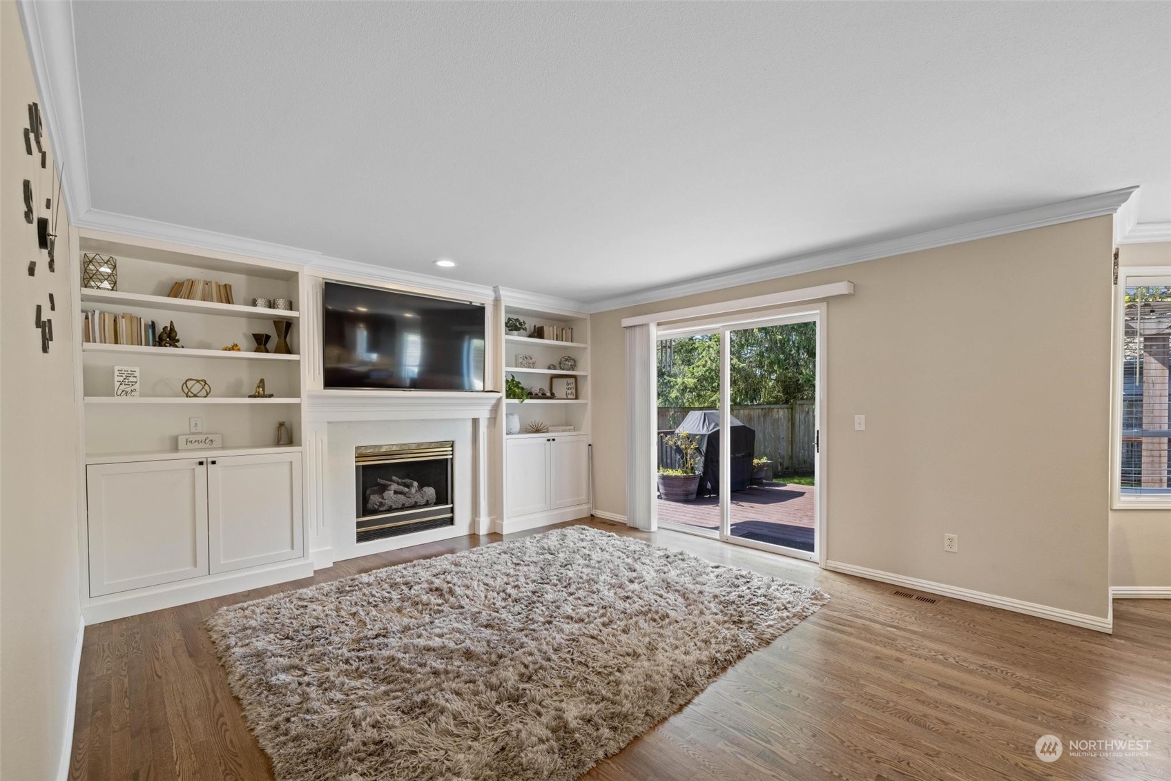 37607 18th Place South Federal Way, WA 98003 - Photo 18 of 40 a living room with a fireplace cabinet and a fireplace