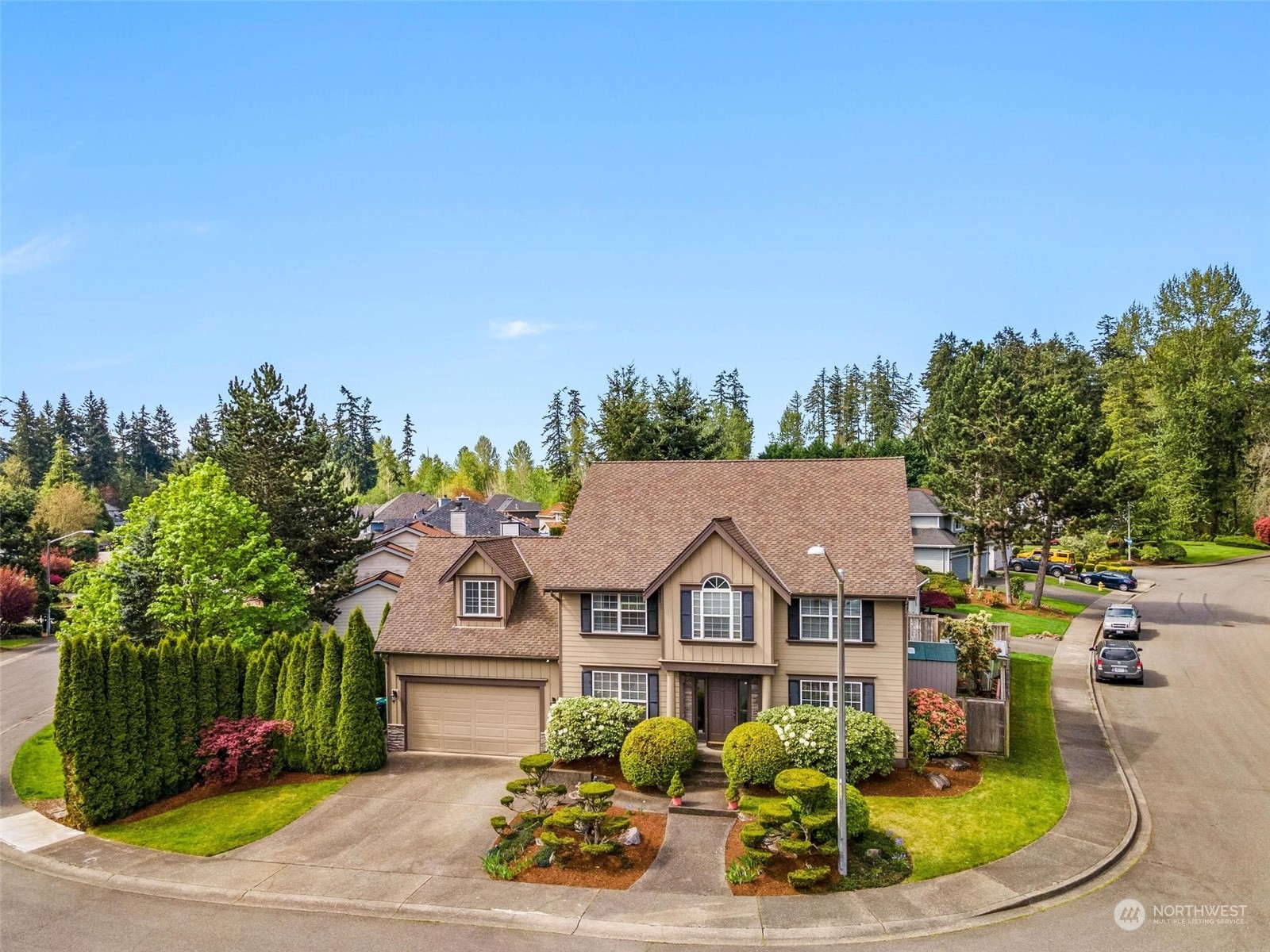 37607 18th Place South Federal Way, WA 98003 - Photo 2 of 40 a view of a white house with a big yard and potted plants