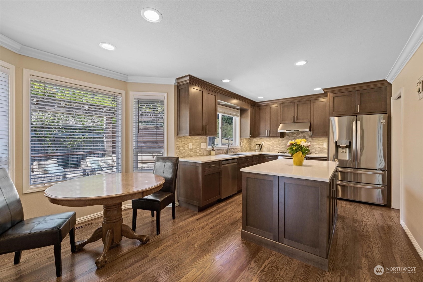 37607 18th Place South Federal Way, WA 98003 - Photo 21 of 40 a kitchen with refrigerator cabinets dining table and chairs