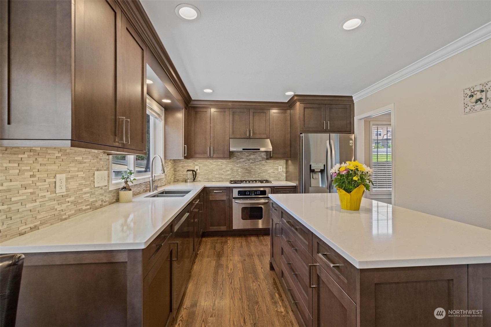 37607 18th Place South Federal Way, WA 98003 - Photo 23 of 40 a kitchen with a sink a stove cabinets and a wooden floor