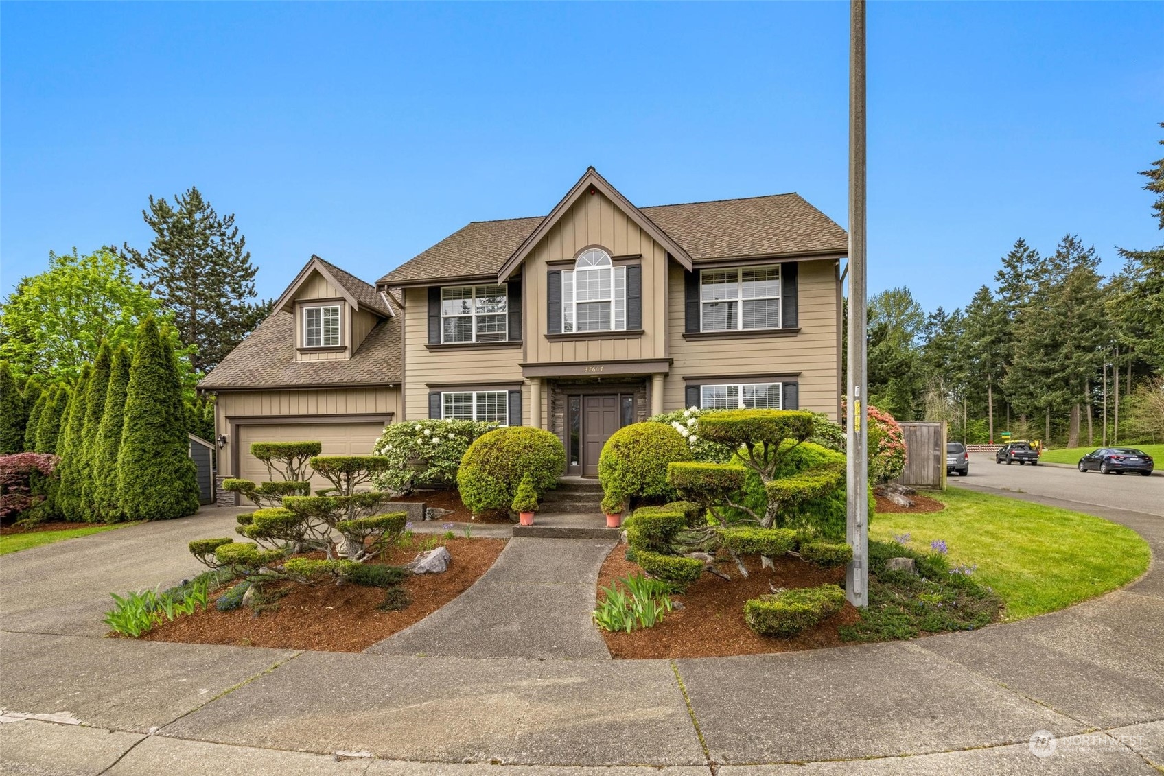 37607 18th Place South Federal Way, WA 98003 - Photo 3 of 40 a front view of a house with garden