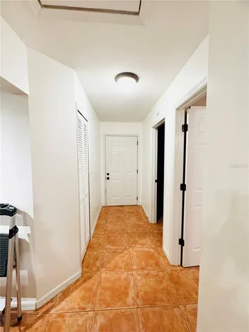 a view of a big room with closet and wooden floor