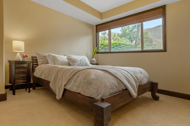 a bathroom with a granite countertop sink a toilet and shower