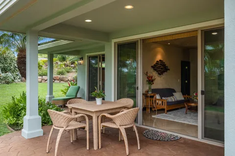 a dining room with furniture and a garden