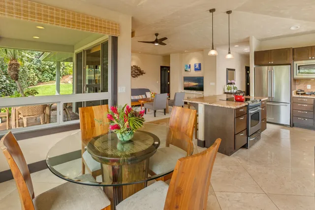 a view of swimming pool with a lounge chairs
