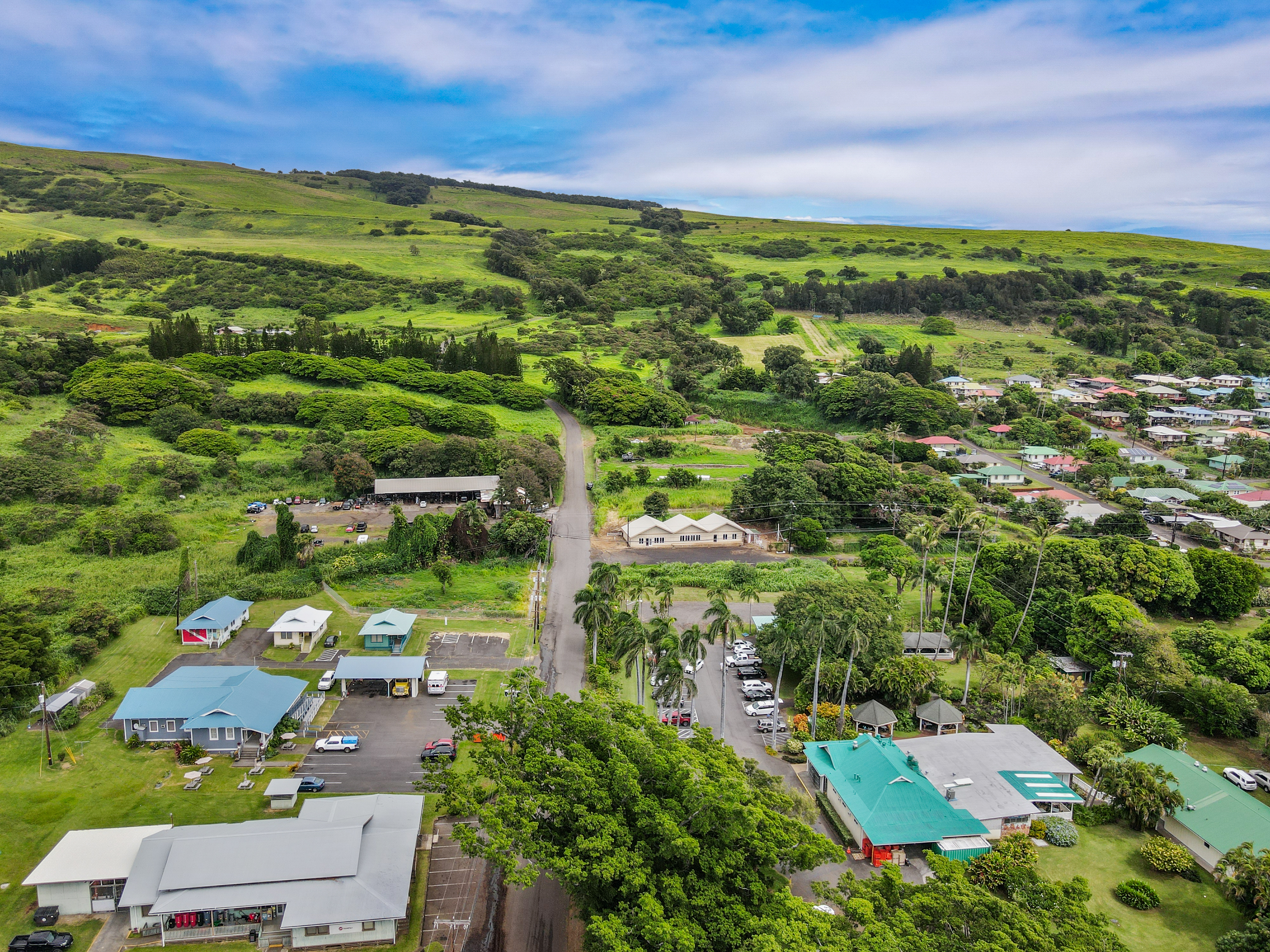95-1178 Kaalaiki Road Naalehu, HI 96772 - Photo 3 of 22 an aerial view of residential houses with outdoor space and trees