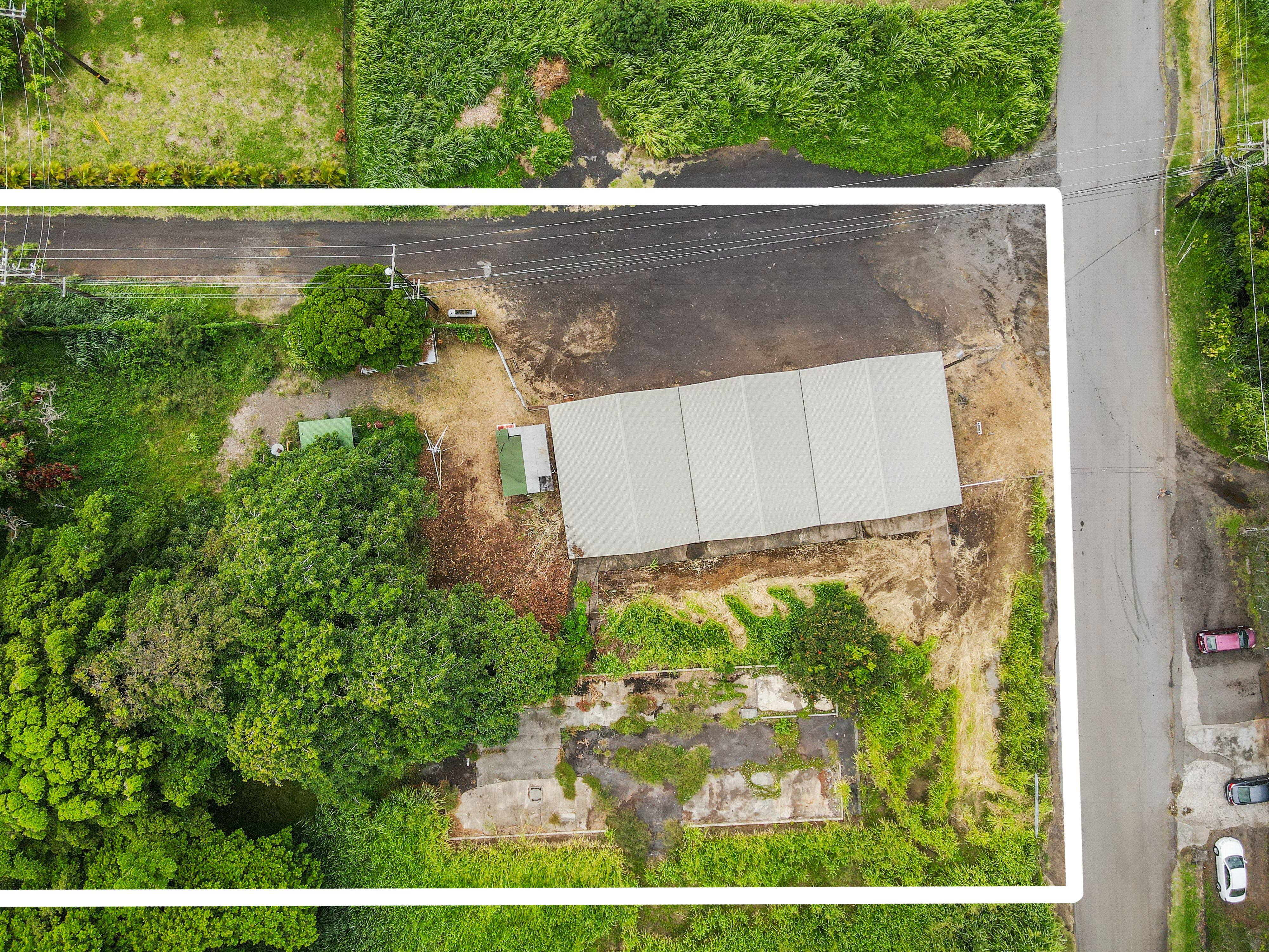 95-1178 Kaalaiki Road Naalehu, HI 96772 - Photo 6 of 22 front view of a house with a yard