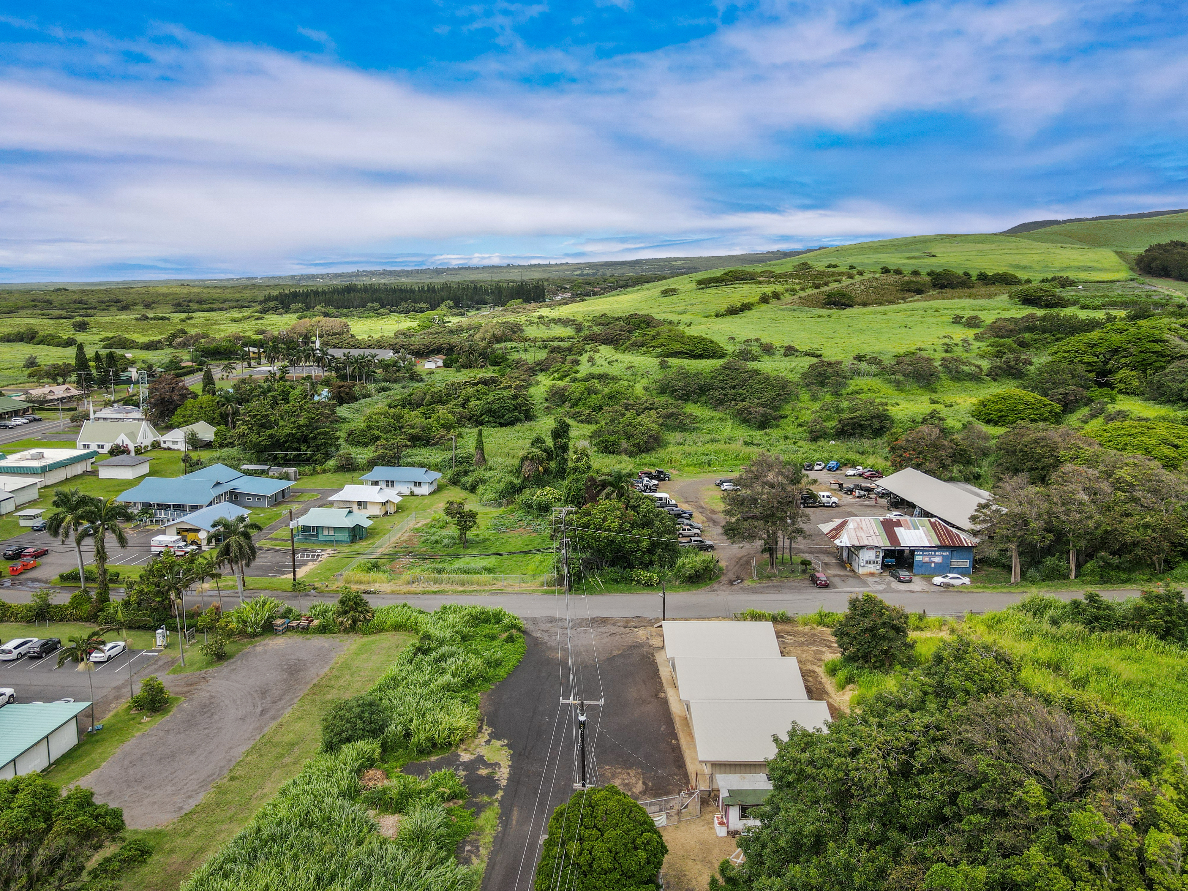 95-1178 Kaalaiki Road Naalehu, HI 96772 - Photo 7 of 22 an aerial view of residential houses with outdoor space and trees