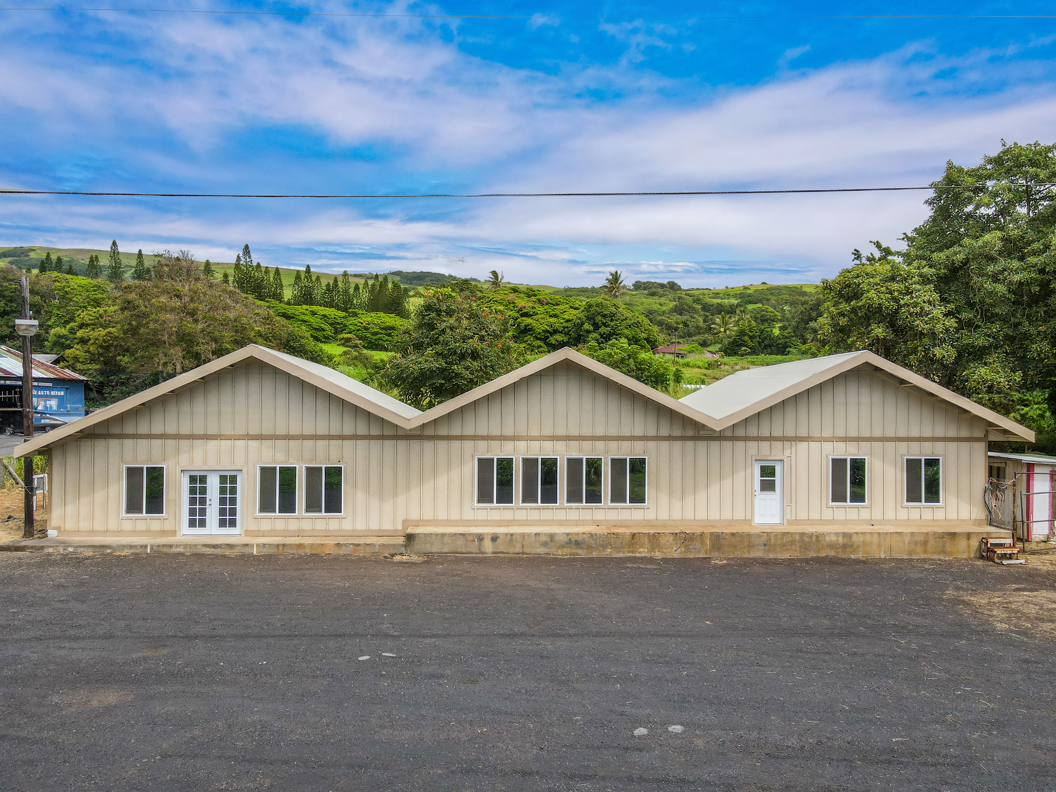 95-1178 Kaalaiki Road Naalehu, HI 96772 - Photo 10 of 22 a view of a house with a big yard and large trees