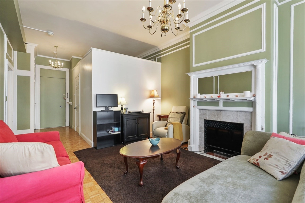 21 Beacon Street, Unit 4S Boston, MA 02108 - Photo 4 of 16 a living room with furniture and a fireplace