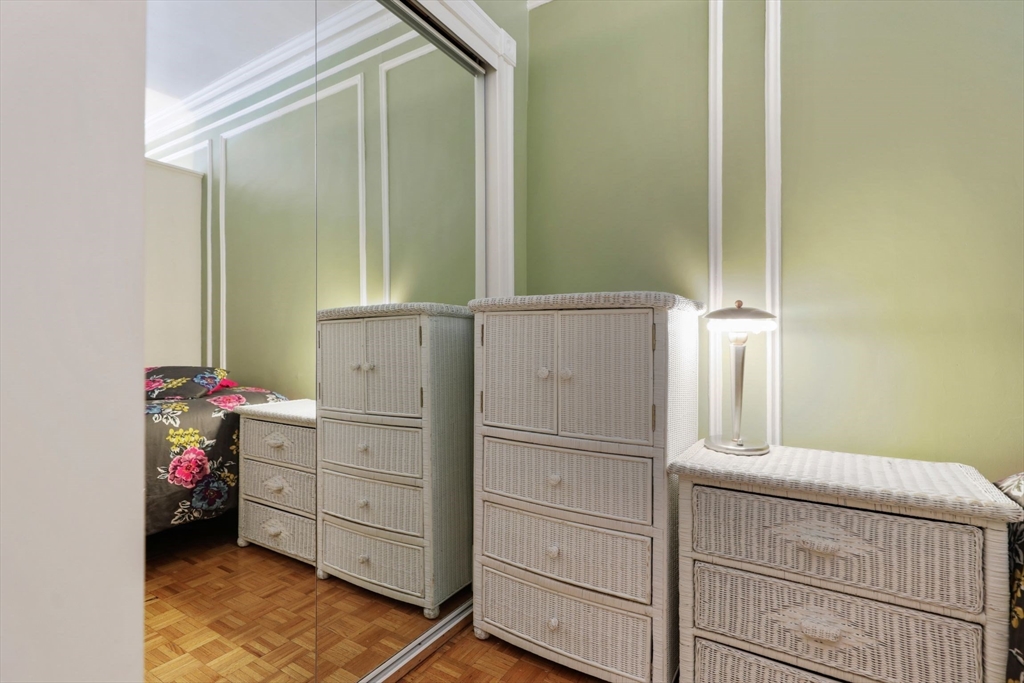 21 Beacon Street, Unit 4S Boston, MA 02108 - Photo 9 of 16 a kitchen with a refrigerator and white cabinets