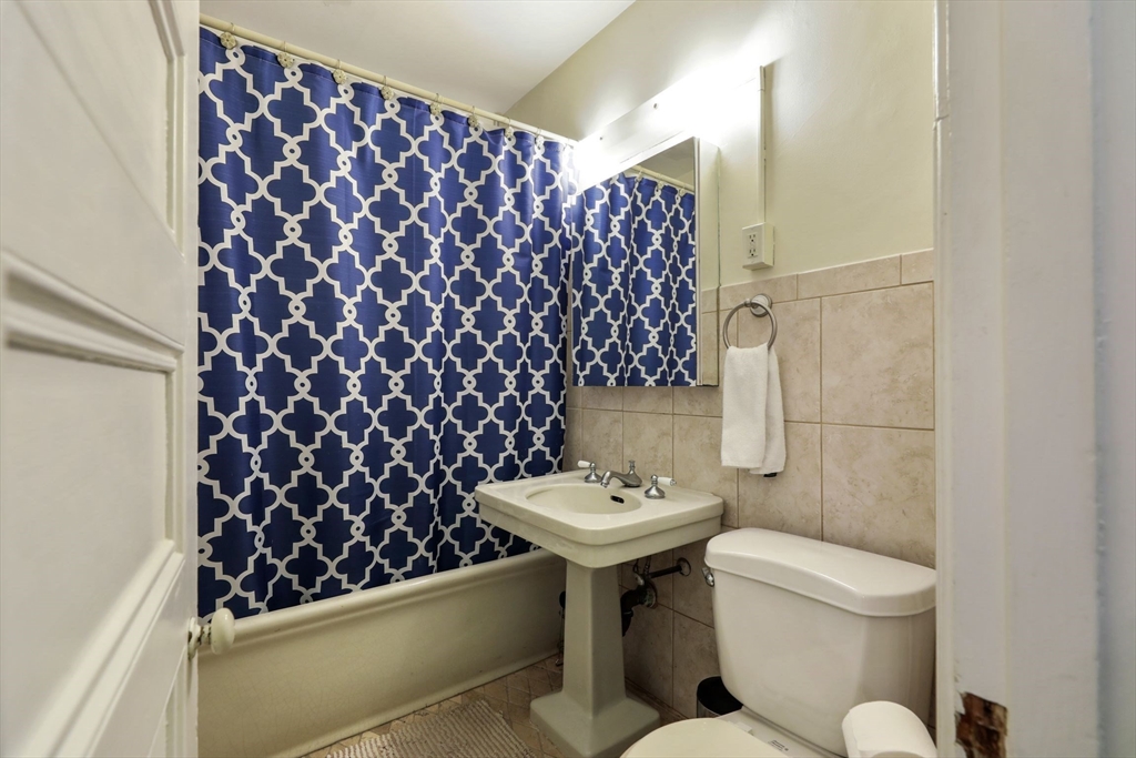 21 Beacon Street, Unit 4S Boston, MA 02108 - Photo 10 of 16 a bathroom with a sink toilet and shower