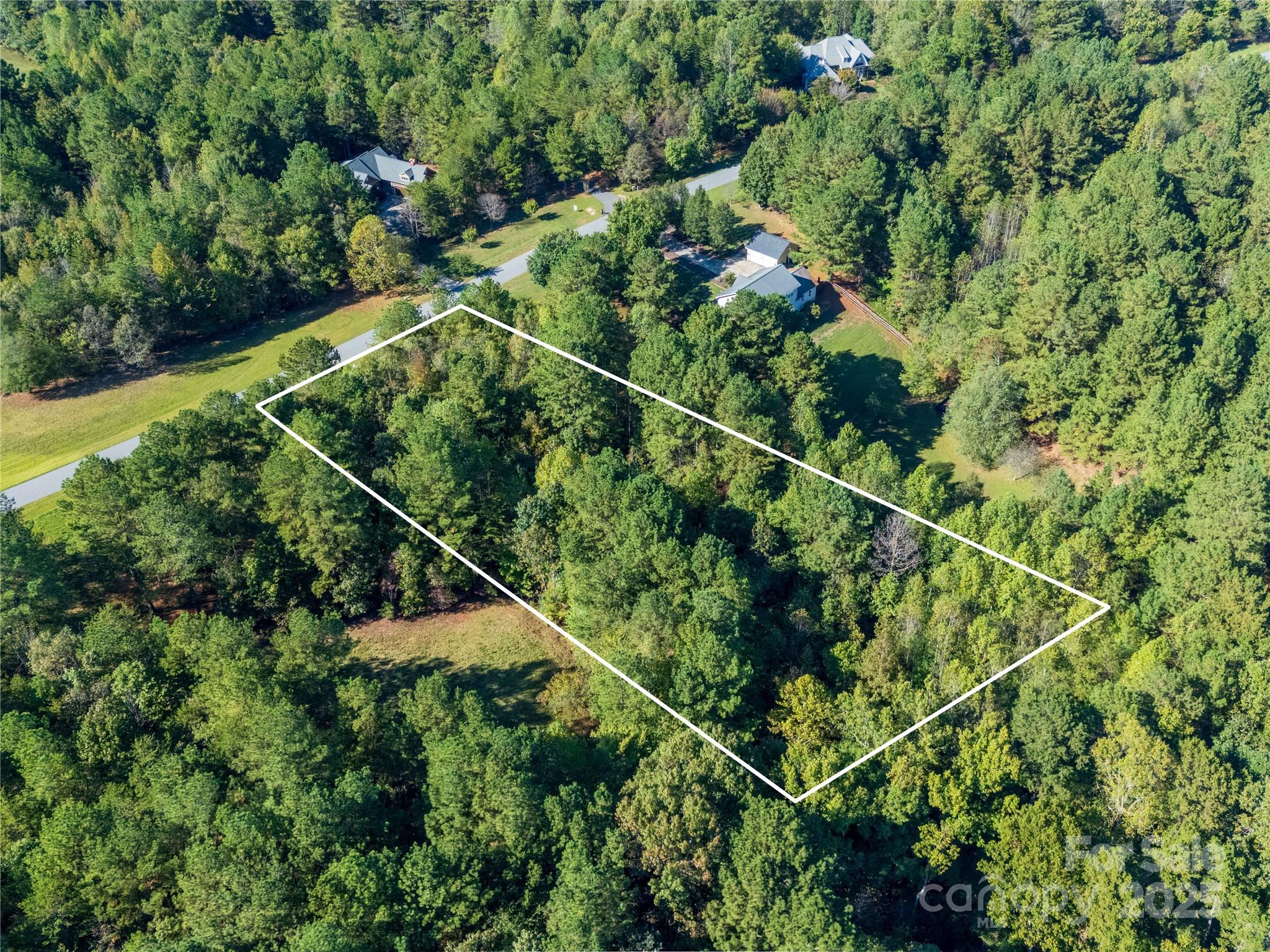 283 Rivercliff Drive, Unit 20 Stony Point, NC 28678 - Photo 15 of 16 an aerial view of a house with a yard
