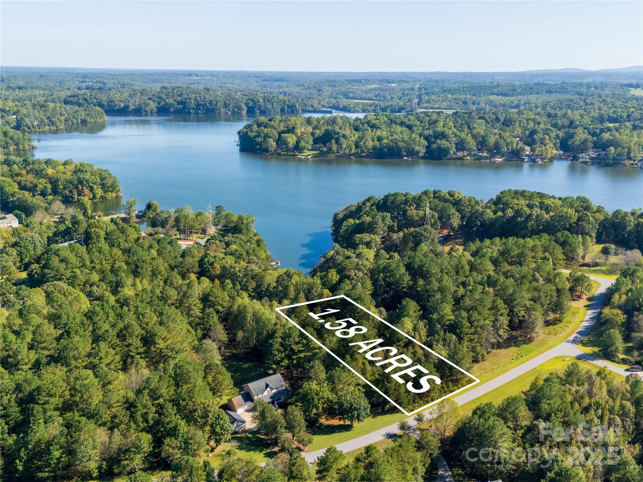 283 Rivercliff Drive, Unit 20 Stony Point, NC 28678 - Photo 3 of 16 an aerial view of a residential houses with outdoor space and lake view