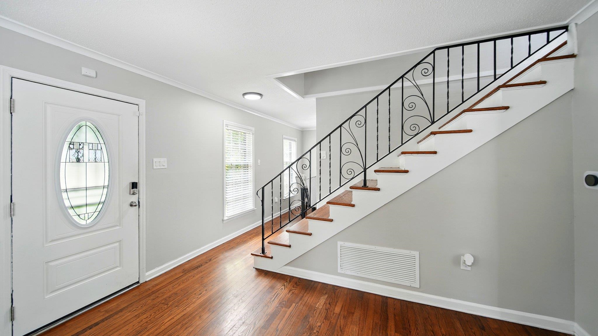 359 South Fenwick Road Memphis, TN 38111 - Photo 5 of 31 Foyer featuring crown molding and dark wood finished floors