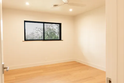 a view of a wall with a large window