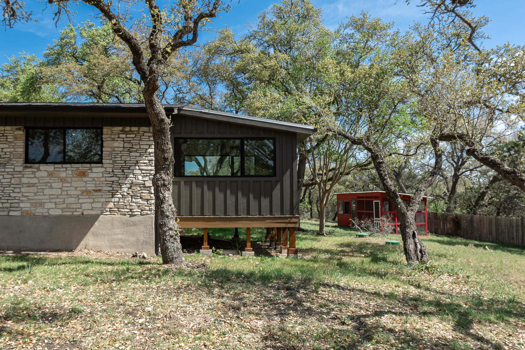8717 South View Road Austin, TX 78737 - Photo 28 of 36 a front view of a house with garden