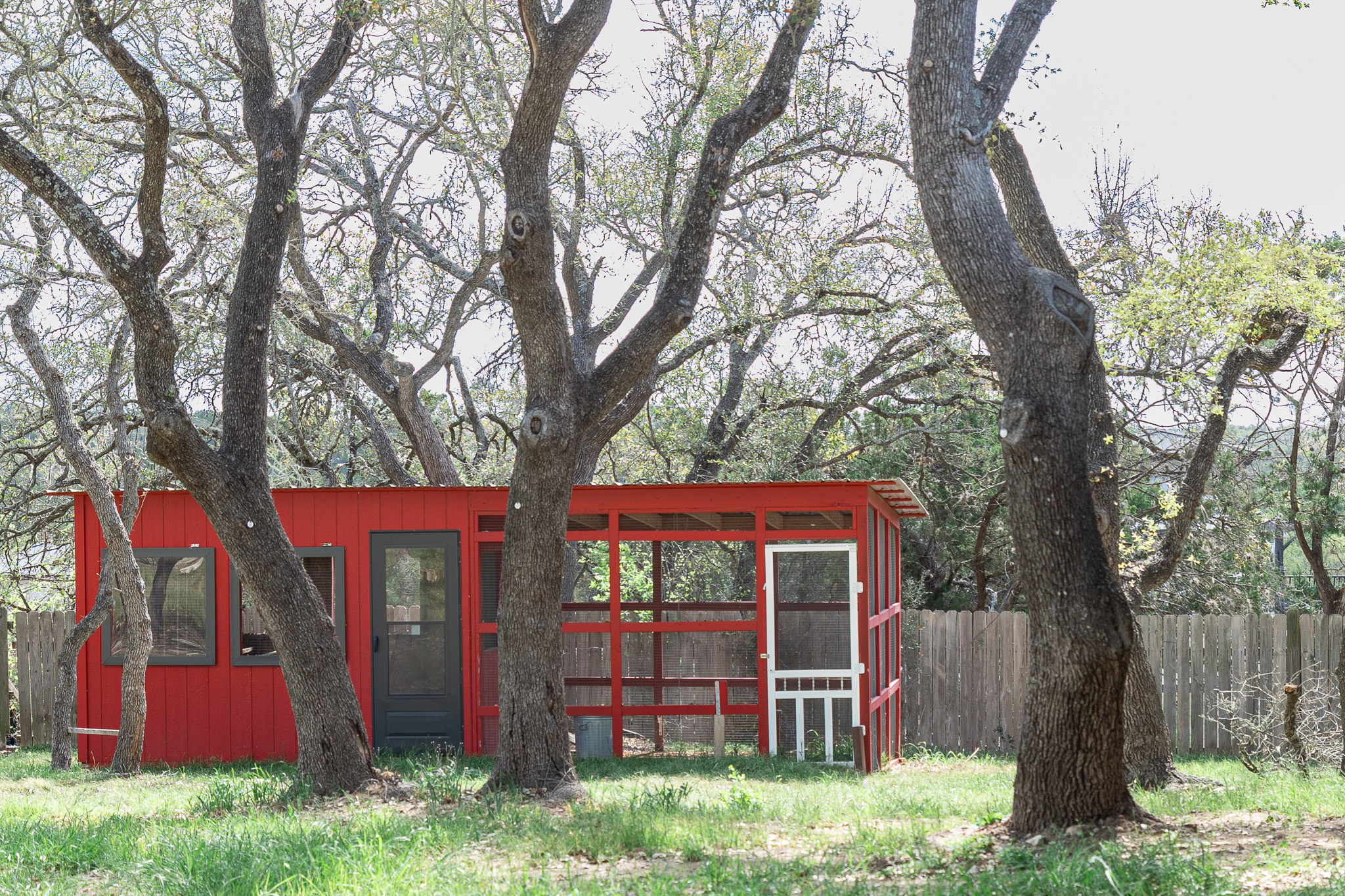 8717 South View Road Austin, TX 78737 - Photo 29 of 36 a view of a house with a yard