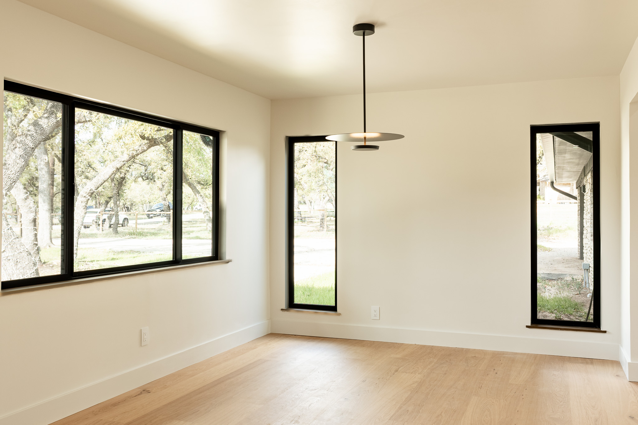 8717 South View Road Austin, TX 78737 - Photo 4 of 36 a view of an empty room with a window