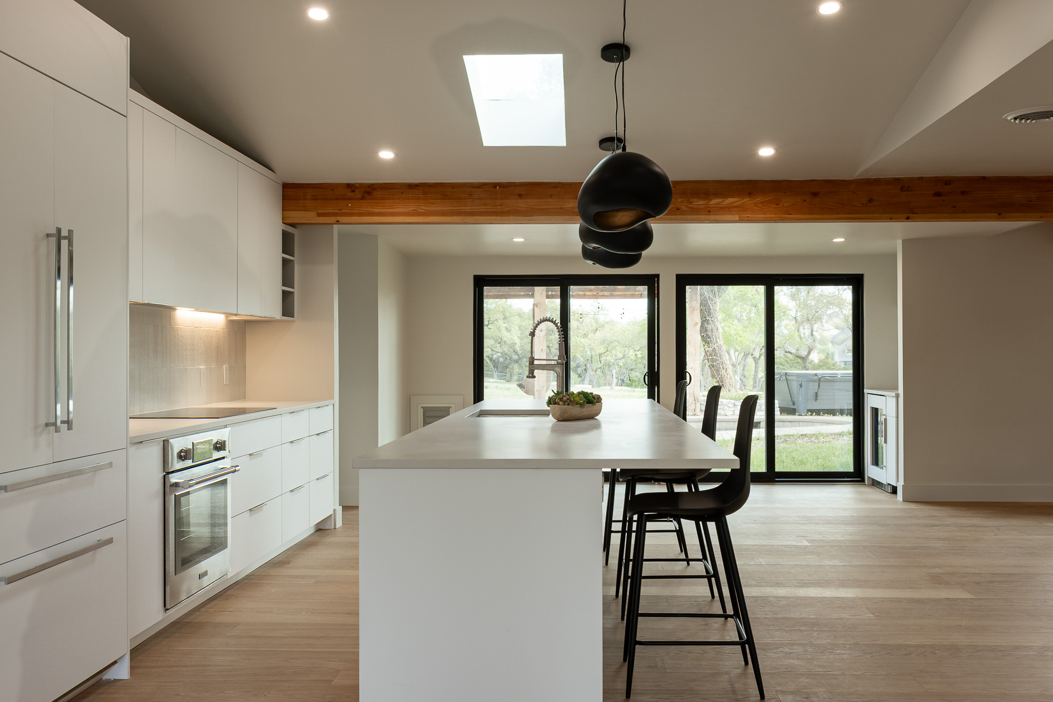8717 South View Road Austin, TX 78737 - Photo 8 of 36 a kitchen with a table chairs and a stove