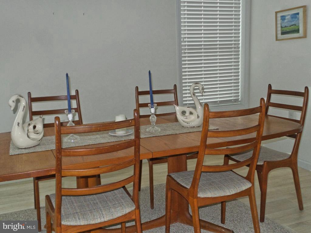 1603 Mill Creek Road Manahawkin, NJ 08050 - Photo 3 of 13 a view of a room that has a table and chairs in it