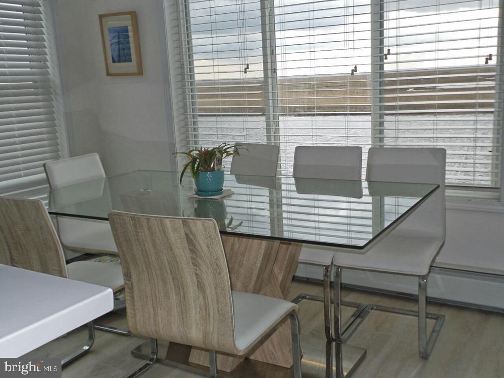 1603 Mill Creek Road Manahawkin, NJ 08050 - Photo 5 of 13 a view of a dining room with furniture and window