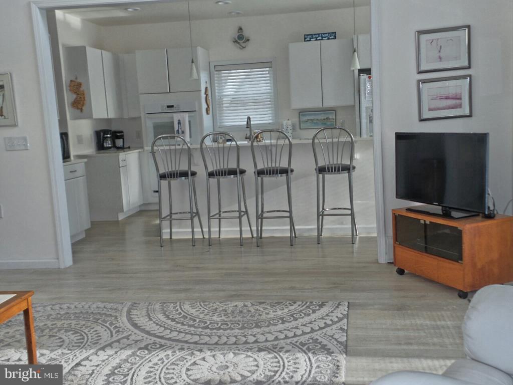 1603 Mill Creek Road Manahawkin, NJ 08050 - Photo 6 of 13 a view of kitchen with furniture and flat screen tv