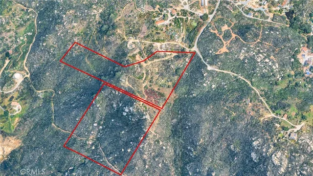 a backyard of a house with lots of trees