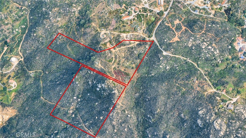 a backyard of a house with lots of trees