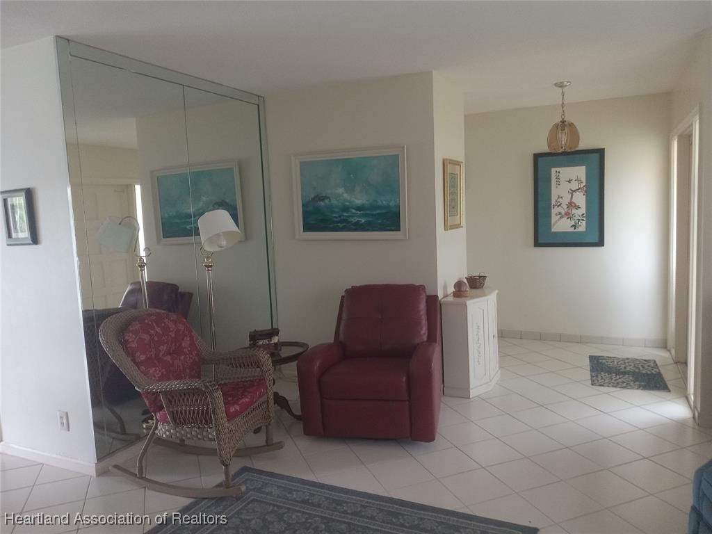 756 Coventry Street Boca Raton, FL 33487 - Photo 3 of 23 a living room with furniture and a painting on the wall