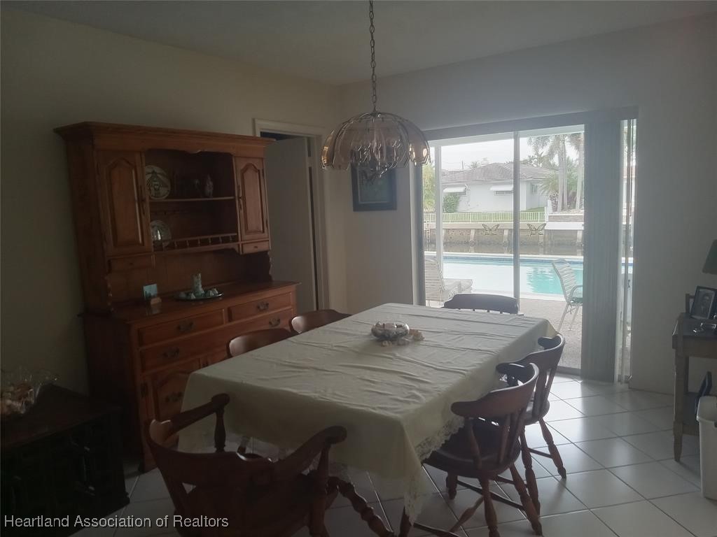756 Coventry Street Boca Raton, FL 33487 - Photo 6 of 23 a dining room with a table and chairs