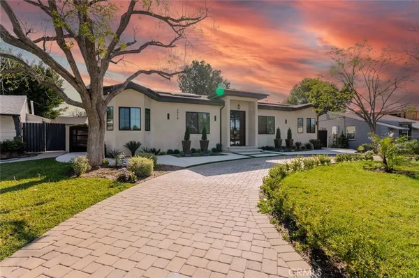 a view of a patio with couches chairs and a fire pit