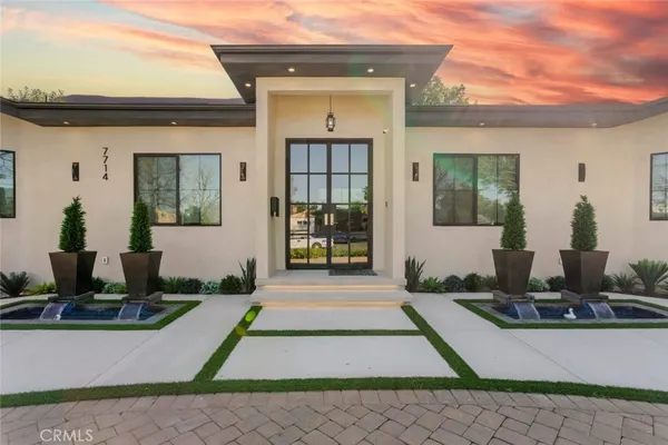 a view of a patio with couches and a fire pit