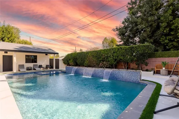 a view of a room with gym equipment and a large window