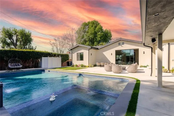 a living room with furniture window and wooden floor
