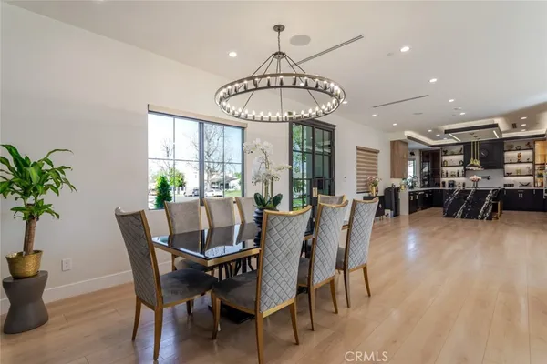a kitchen with granite countertop a sink stove and cabinets