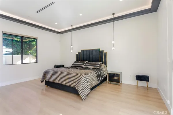 a livingroom with workspace and a couch