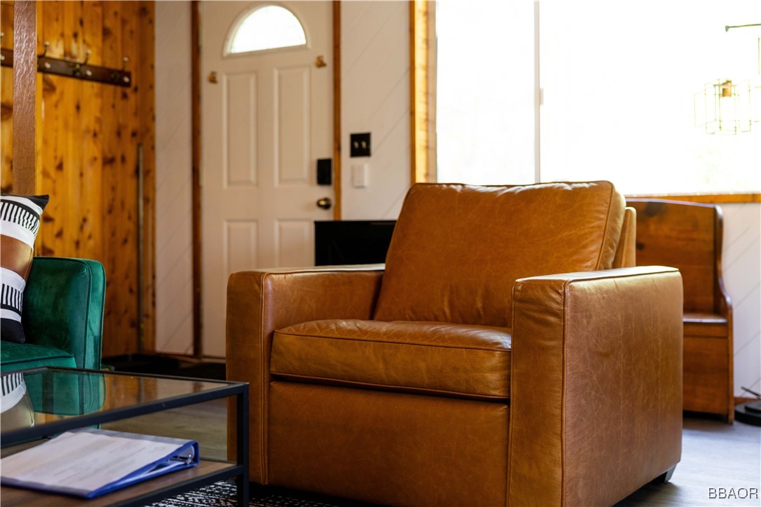 753 Maple Lane Sugarloaf, CA 92386 - Photo 19 of 50 a blue bed sitting in a living room next to a window