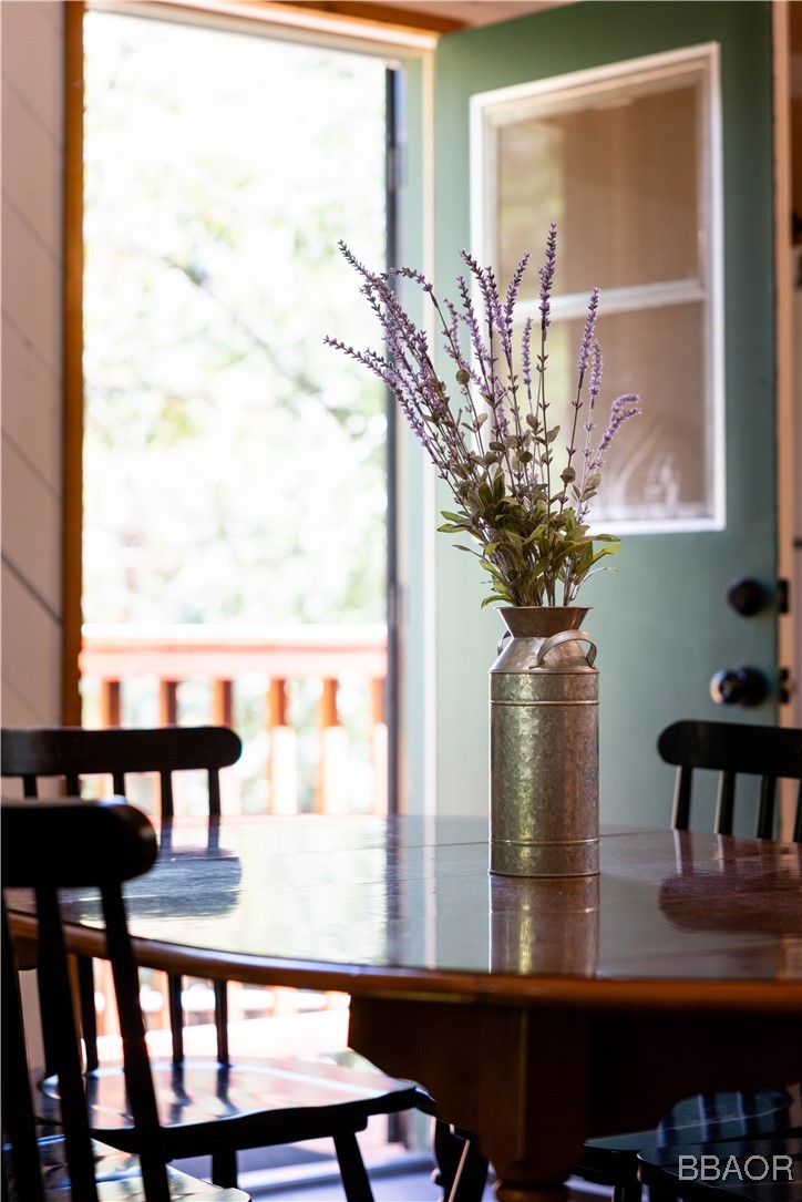 753 Maple Lane Sugarloaf, CA 92386 - Photo 26 of 50 a vase of flowers sitting on a table with window