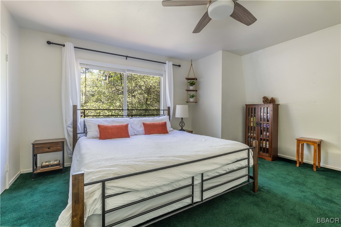 753 Maple Lane Sugarloaf, CA 92386 - Photo 29 of 50 a bed sitting in a bedroom next to a window