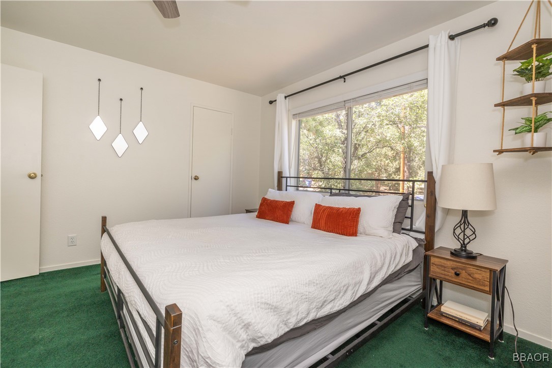 753 Maple Lane Sugarloaf, CA 92386 - Photo 30 of 50 a bedroom with a bed and a window
