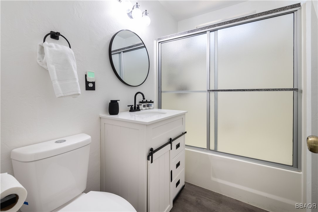 753 Maple Lane Sugarloaf, CA 92386 - Photo 33 of 50 a bathroom with a sink mirror toilet and vanity