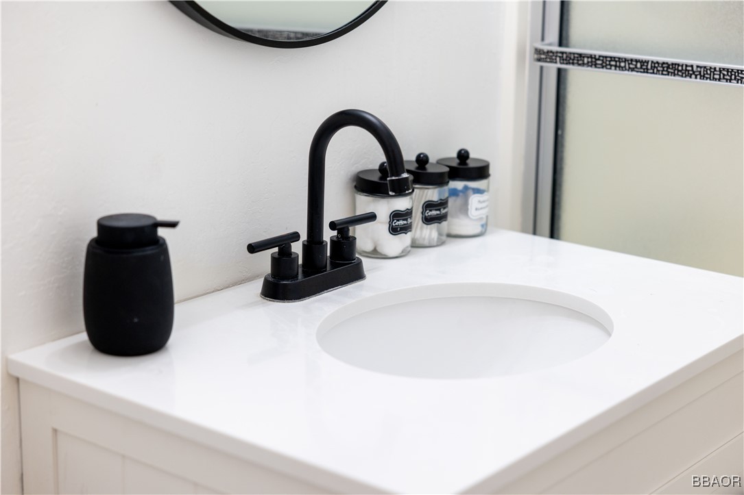 753 Maple Lane Sugarloaf, CA 92386 - Photo 35 of 50 a close view of a sink a faucet and gym equipment