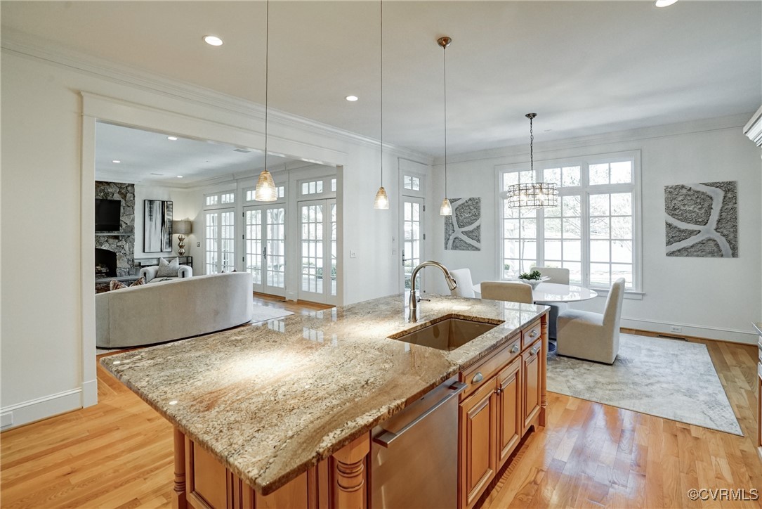 203 Kinloch Road Manakin-Sabot, VA 23103 - Photo 24 of 49 a kitchen with granite countertop a sink a counter top space and living room view